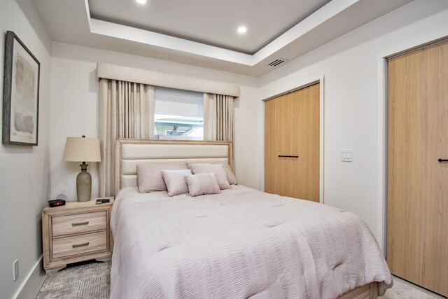 bedroom featuring a tray ceiling