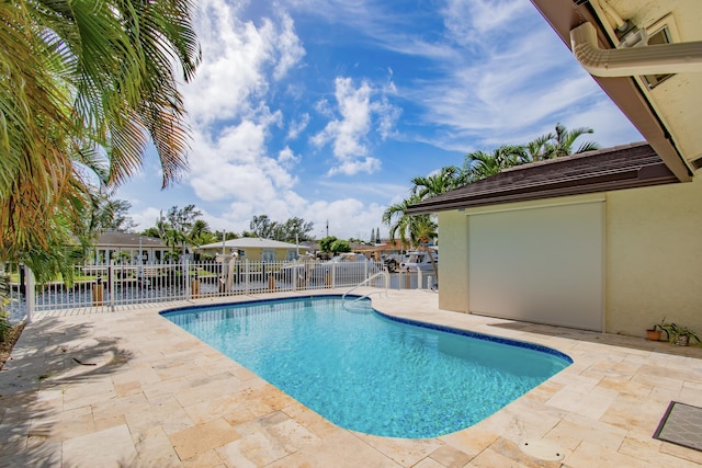 view of swimming pool with a patio