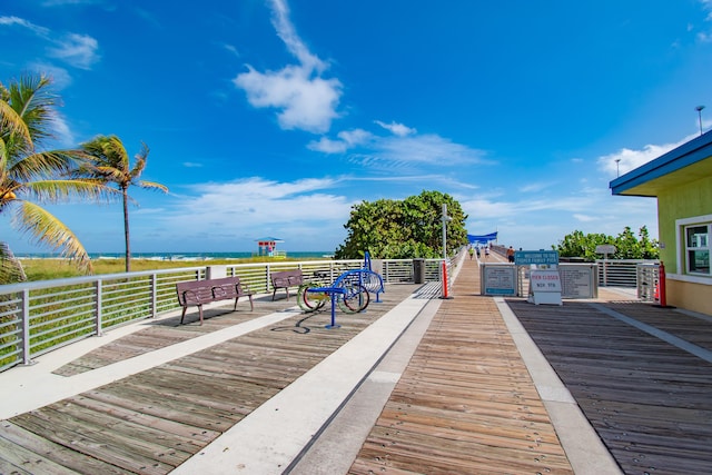 wooden terrace featuring a water view