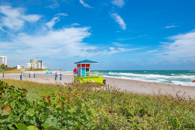 property view of water featuring a beach view