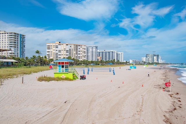 water view featuring a gazebo and a beach view