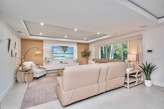 living room featuring a tray ceiling