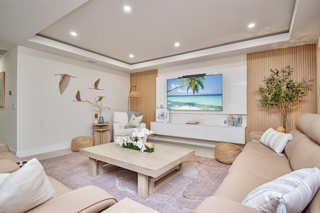 living room featuring a tray ceiling