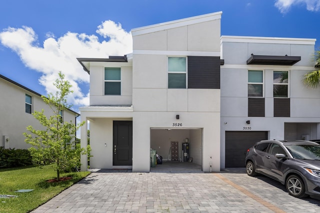 3526 Joshua Tree St, Palm Springs, FL 33461 - view of front facade featuring a garage, driveway, and stucco siding