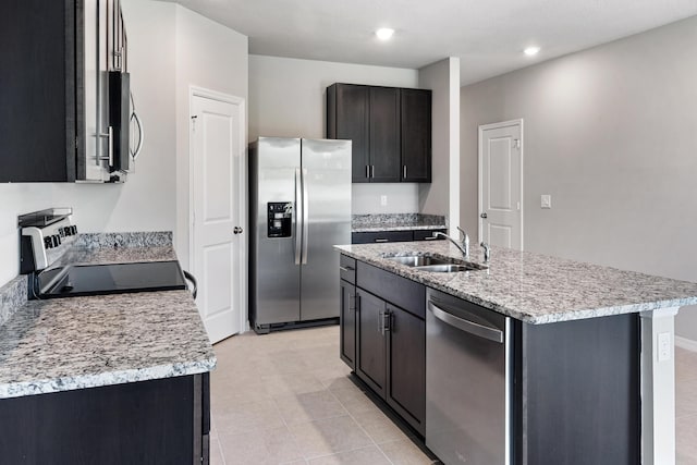 3526 Joshua Tree St, Palm Springs, FL 33461 - kitchen with stainless steel appliances, a sink, a center island with sink, recessed lighting, and light tile patterned flooring