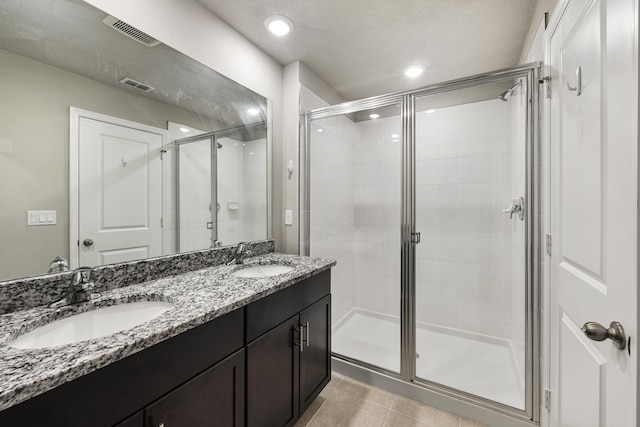 3526 Joshua Tree St, Palm Springs, FL 33461 - full bath with a shower stall, double vanity, tile patterned flooring, and recessed lighting
