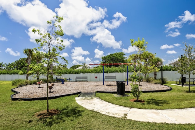 view of playground featuring a lawn