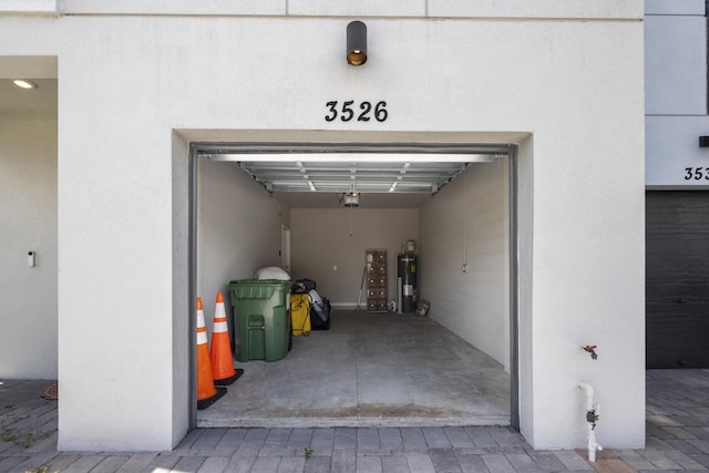 3526 Joshua Tree St, Palm Springs, FL 33461 - garage featuring water heater and a garage door opener