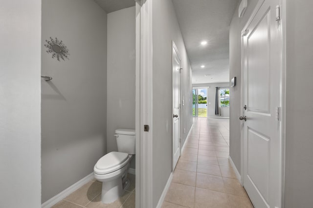 3526 Joshua Tree St, Palm Springs, FL 33461 - bathroom with baseboards, tile patterned flooring, toilet, recessed lighting, and a textured ceiling
