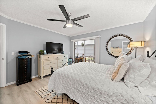 27 Lake Vista Trl Unit 107, Port Saint Lucie, FL 34952 - bedroom with light wood-style flooring, a textured ceiling, ornamental molding, access to exterior, and ceiling fan