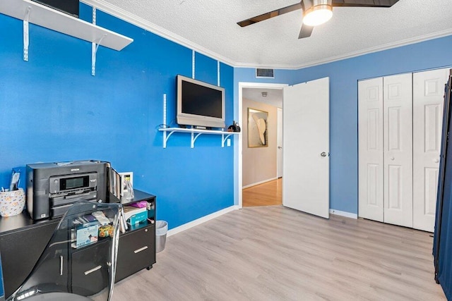 27 Lake Vista Trl Unit 107, Port Saint Lucie, FL 34952 - office space featuring crown molding, a ceiling fan, a textured ceiling, wood finished floors, and baseboards