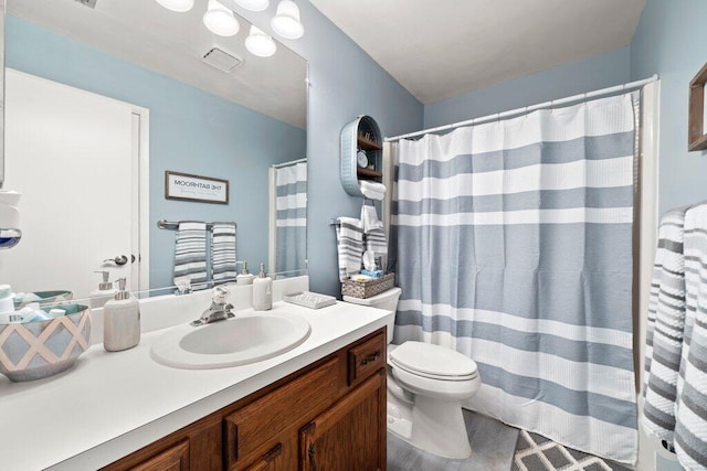 27 Lake Vista Trl Unit 107, Port Saint Lucie, FL 34952 - full bath featuring vanity, toilet, and a shower with shower curtain