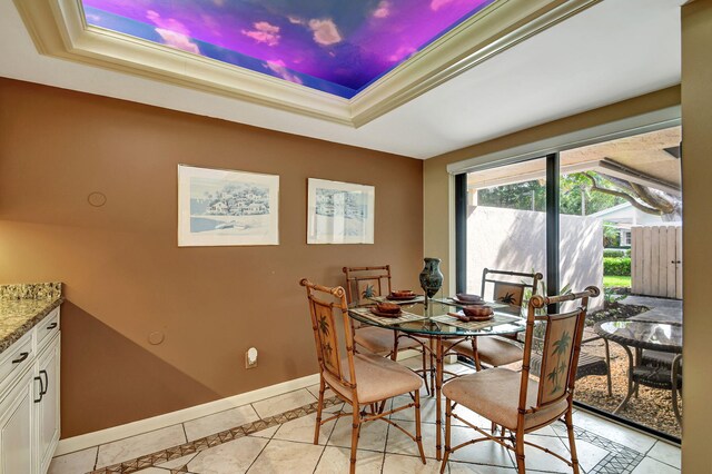 tiled dining room featuring sink