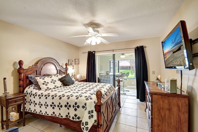 tiled bedroom featuring access to outside, ceiling fan, and a textured ceiling