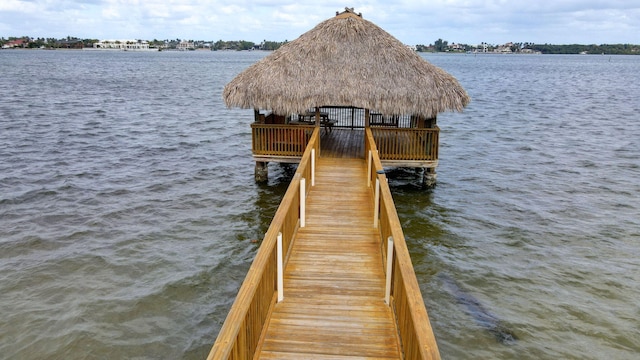 dock area with a gazebo and a water view