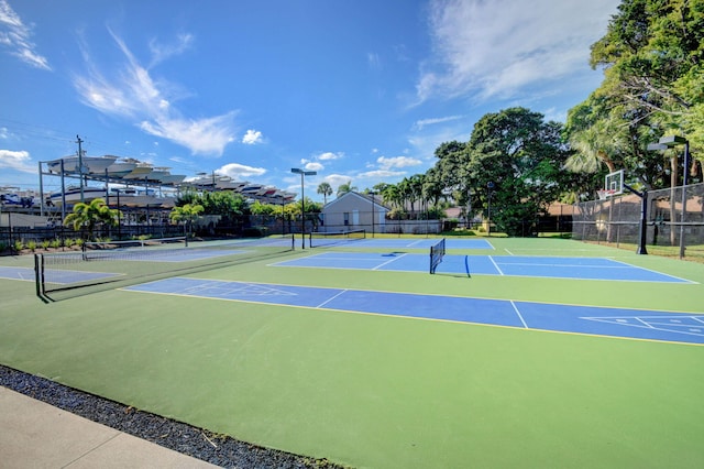 view of sport court featuring community basketball court and fence