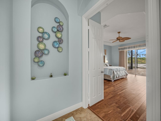 bedroom with wood-type flooring, ceiling fan, and access to exterior