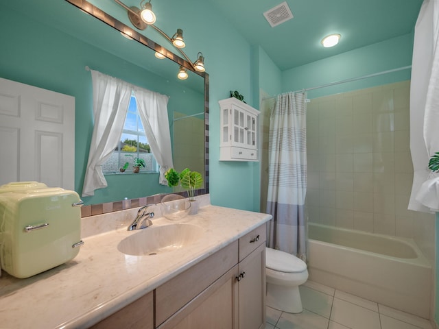 full bathroom featuring vanity, tile patterned flooring, shower / bathtub combination with curtain, and toilet