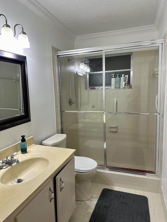 bathroom with a textured ceiling, vanity, an enclosed shower, crown molding, and tile patterned floors