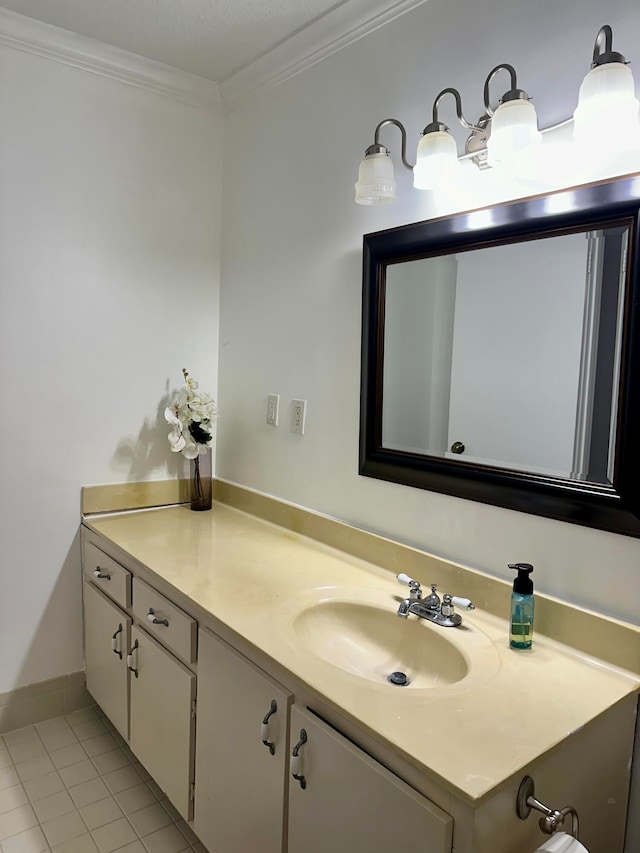 bathroom with tile patterned flooring, vanity, and ornamental molding