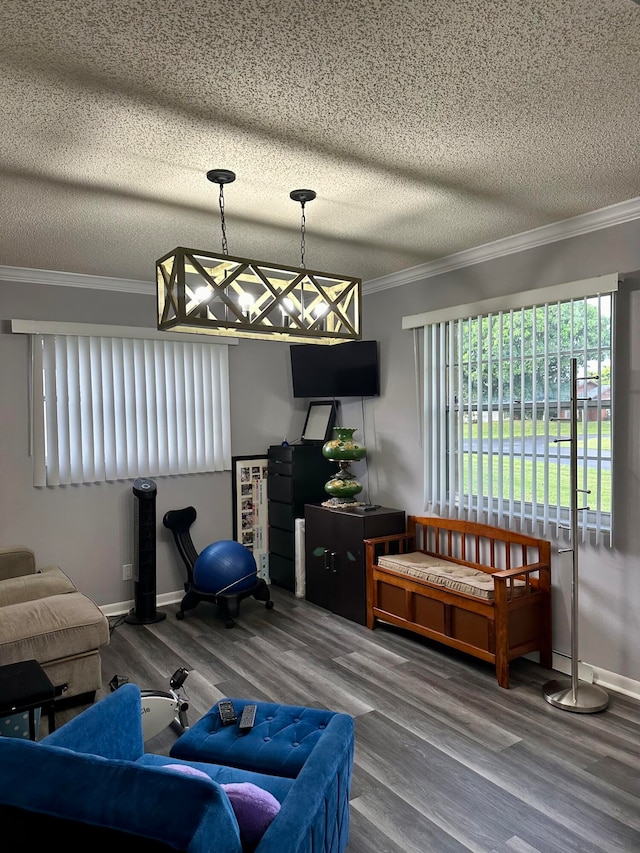 living room featuring hardwood / wood-style flooring, a textured ceiling, and crown molding