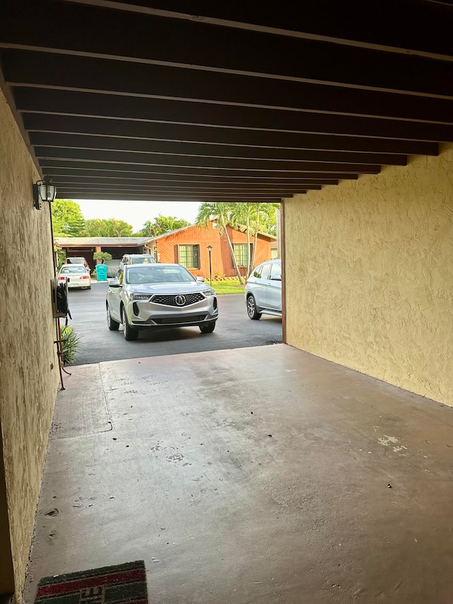 garage featuring a carport