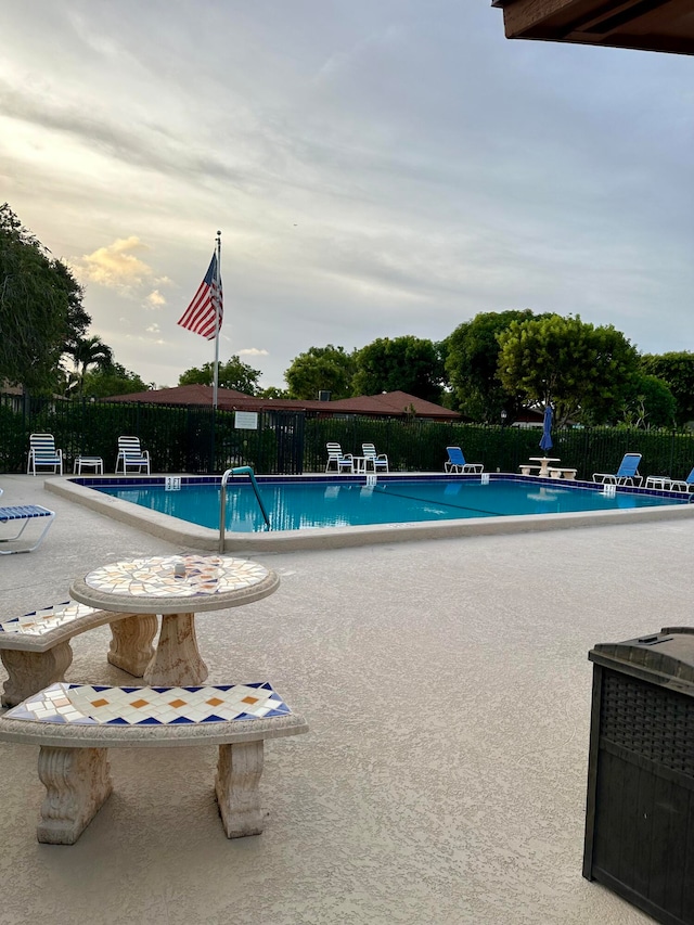 view of swimming pool featuring a patio