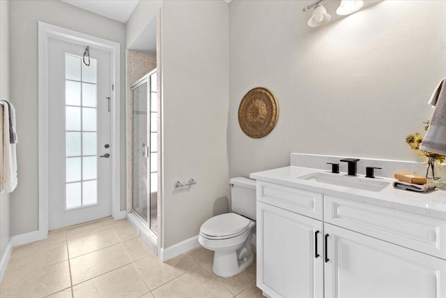 bathroom featuring toilet, tile patterned flooring, a healthy amount of sunlight, and walk in shower