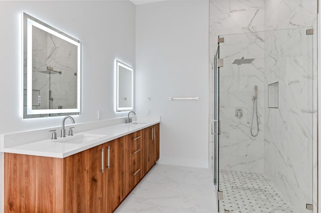 bathroom with vanity and a shower with shower door