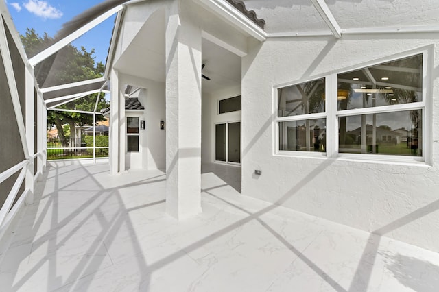 unfurnished sunroom featuring lofted ceiling with beams