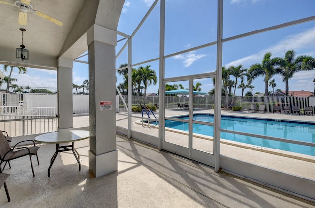 view of pool with ceiling fan and a patio area