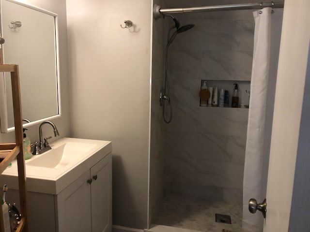 bathroom with vanity and a shower with shower curtain