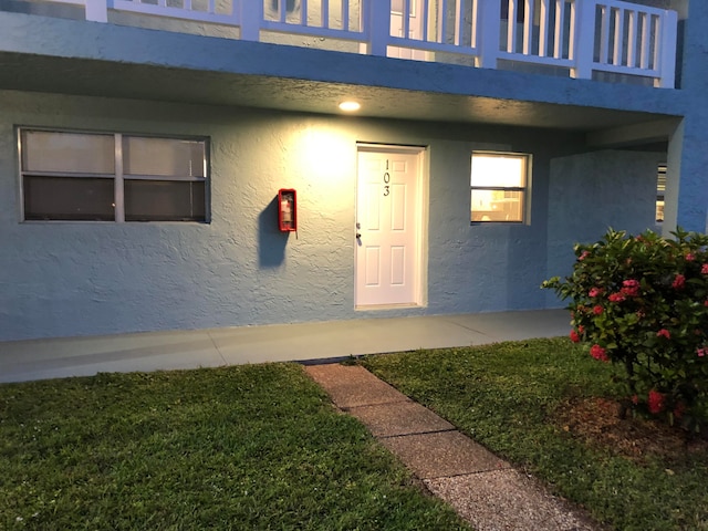 property entrance with a balcony