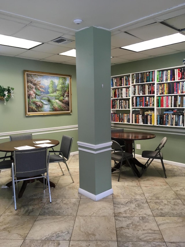 interior space featuring a drop ceiling