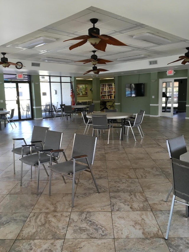 dining area with french doors and ceiling fan