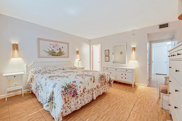 bedroom featuring light tile patterned flooring