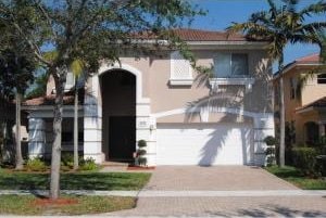 view of front of home with a garage