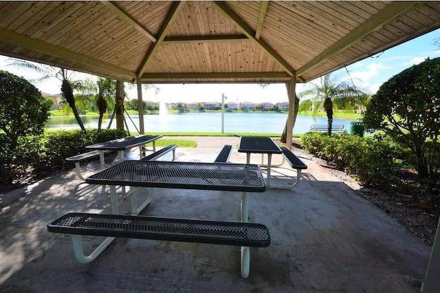 view of patio / terrace featuring a gazebo and a water view