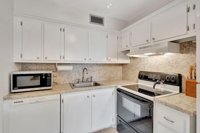 kitchen featuring black electric range, white cabinetry, light tile patterned floors, white dishwasher, and sink