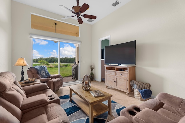 tiled living room with ceiling fan