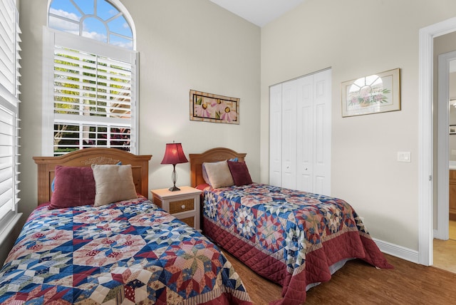 bedroom featuring hardwood / wood-style flooring and a closet