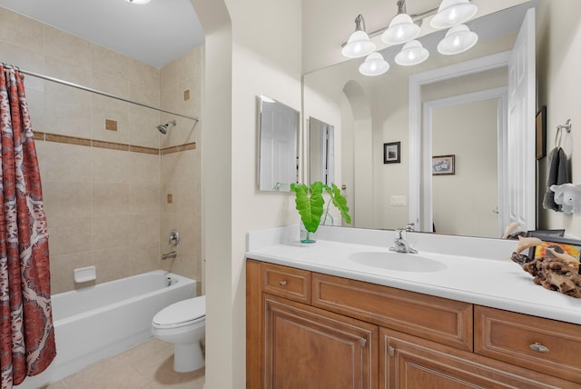 full bathroom featuring tile patterned floors, vanity, a notable chandelier, toilet, and shower / bath combo with shower curtain