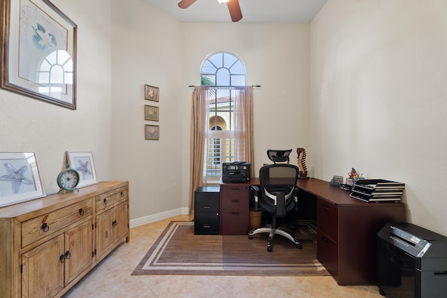 home office with ceiling fan and light tile patterned flooring