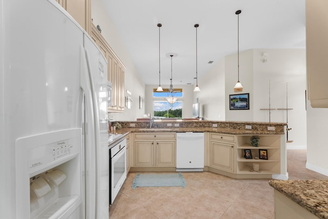 kitchen featuring pendant lighting, cream cabinets, white appliances, and stone countertops