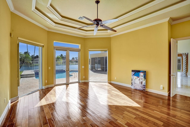 interior space featuring ornamental molding, french doors, wood-type flooring, and ceiling fan