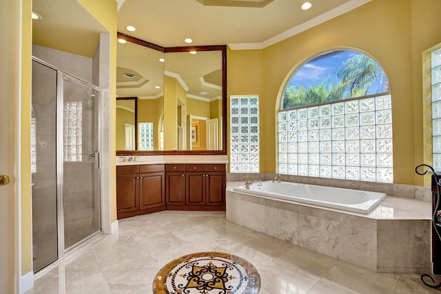 bathroom featuring vanity, ornamental molding, and separate shower and tub