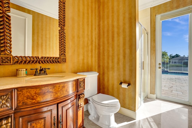 bathroom featuring ornamental molding, vanity, tile patterned floors, and toilet