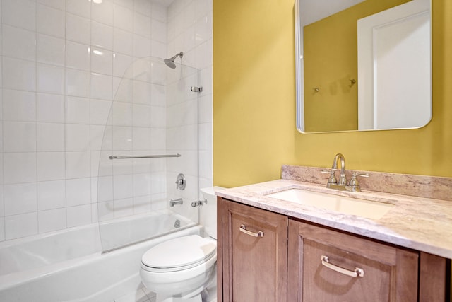 full bathroom featuring vanity, toilet, and tiled shower / bath