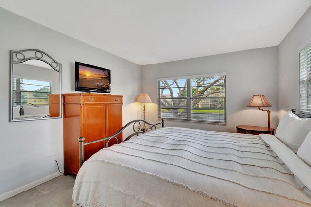 bedroom featuring multiple windows