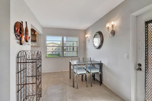 dining area with light tile patterned floors